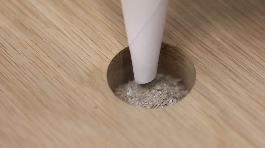 The ashes being placed in the space