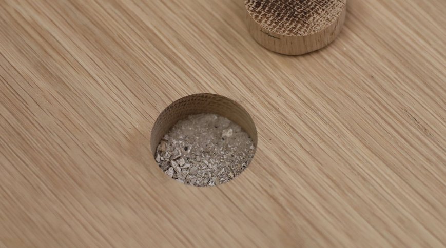 The filled space, with the solid oak plug beside it