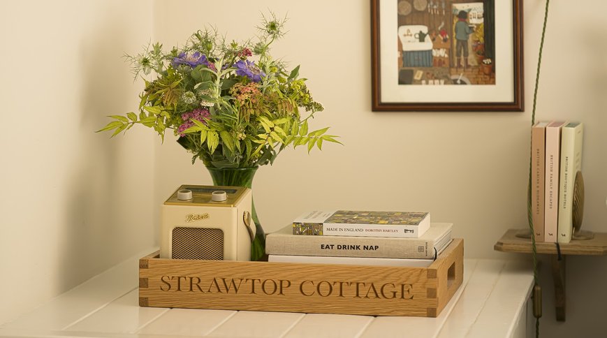 The STRAWTOP COTTAGE butler tray on the bedside table. Photo: Sarah Frances Kelley