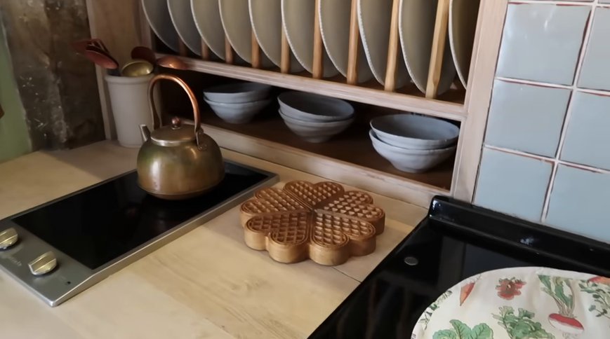The waffle trivet board beside the Aga. Still: Josie Irons on YouTube